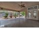 An outdoor kitchen, water feature, and ceiling fan make this tiled patio perfect for entertaining at 1501 Via Salaria Ct, Henderson, NV 89052