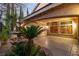 Outdoor patio with mature landscaping, water feature, and shade at 1501 Via Salaria Ct, Henderson, NV 89052