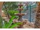 Outdoor living is emphasized with this large, tiered stone water fountain at 1501 Via Salaria Ct, Henderson, NV 89052