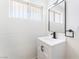 Bathroom boasts a stylish vanity with modern fixtures and hardware, complemented by a bright window at 2878 El Cajon St, Las Vegas, NV 89169