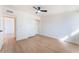 A bright bedroom features a ceiling fan, closet and light wood floors at 2878 El Cajon St, Las Vegas, NV 89169
