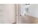 Bright bedroom featuring wood floors, a ceiling fan, and ample closet space at 2878 El Cajon St, Las Vegas, NV 89169