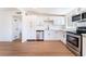 Modern kitchen features stainless steel appliances and sleek white cabinets at 2878 El Cajon St, Las Vegas, NV 89169