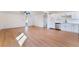 Open-concept living area with wood floors seamlessly connects to the kitchen at 2878 El Cajon St, Las Vegas, NV 89169