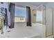 Bright bathroom featuring a soaking tub and separate walk-in glass enclosed shower at 320 Point Loma Ave, North Las Vegas, NV 89031