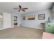 Bonus room featuring carpet, a ceiling fan, and adjacent bedroom and bathroom entries at 320 Point Loma Ave, North Las Vegas, NV 89031