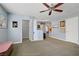 Spacious bonus room with carpet, and entryways to bedrooms and bathrooms at 320 Point Loma Ave, North Las Vegas, NV 89031