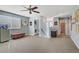 Bonus room with carpet, natural light, washer and dryer hookups, and views of the backyard at 320 Point Loma Ave, North Las Vegas, NV 89031