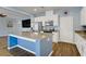 Modern kitchen boasts stainless steel appliances, granite countertops, and a breakfast bar island at 320 Point Loma Ave, North Las Vegas, NV 89031
