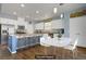 Bright kitchen with a large island and adjacent dining area provides a seamless open concept to the living spaces at 320 Point Loma Ave, North Las Vegas, NV 89031
