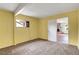 Cozy room with neutral carpet and natural light; view into living space with brick fireplace at 3821 Pacific St, Las Vegas, NV 89121