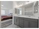 Modern bathroom with double vanities and a large mirror at 605 Cadence Vista Dr, Henderson, NV 89011