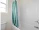 Bright bathroom features a shower with white subway tile and a patterned blue shower curtain at 605 Cadence Vista Dr, Henderson, NV 89011