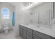 Bright bathroom with a double vanity and a separate toilet room at 605 Cadence Vista Dr, Henderson, NV 89011