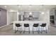 Open kitchen featuring a large island with bar seating and pendant lighting at 605 Cadence Vista Dr, Henderson, NV 89011