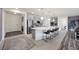 Beautiful kitchen featuring a large island with seating, stainless steel appliances, and an open layout at 605 Cadence Vista Dr, Henderson, NV 89011