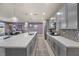 Bright, modern kitchen with stainless steel appliances, quartz countertops, and stylish backsplash at 605 Cadence Vista Dr, Henderson, NV 89011