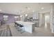 Modern kitchen with a large island, stainless steel appliances, and sleek gray cabinetry at 605 Cadence Vista Dr, Henderson, NV 89011