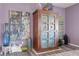 Eclectic living room decor with a rustic wooden cabinet and decorative art at 605 Cadence Vista Dr, Henderson, NV 89011