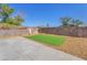 A spacious backyard with artificial turf and gravel landscaping offering low maintenance and versatile outdoor space at 6770 Laronda Ln, Las Vegas, NV 89156