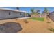 A backyard showcasing a combination of gravel, artificial turf, and a concrete patio for low-maintenance outdoor enjoyment at 6770 Laronda Ln, Las Vegas, NV 89156