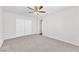 Spacious bedroom features neutral paint, plush carpeting, and a ceiling fan for added comfort at 6770 Laronda Ln, Las Vegas, NV 89156