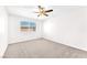 Bright bedroom features a window, carpet flooring and a ceiling fan for added comfort at 6770 Laronda Ln, Las Vegas, NV 89156