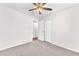 This carpeted bedroom offers a ceiling fan and convenient closet access for storage at 6770 Laronda Ln, Las Vegas, NV 89156