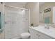 Bathroom with a glass shower enclosure, white vanity, and a neutral color scheme at 10290 Lodge Pine Ave, Las Vegas, NV 89166
