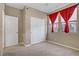 Bedroom featuring carpet, windows with curtains, and a closet at 10290 Lodge Pine Ave, Las Vegas, NV 89166