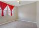 Bedroom with carpet, windows with curtains and a closet, offering comfort and functionality at 10290 Lodge Pine Ave, Las Vegas, NV 89166