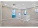 Spacious room featuring carpeted floors, recessed lighting, ceiling fan, and natural light from several windows at 10290 Lodge Pine Ave, Las Vegas, NV 89166
