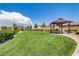 Enjoy a peaceful community green space complete with picnic gazebo, landscaped paths and sprawling grass lawn at 10290 Lodge Pine Ave, Las Vegas, NV 89166