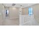 Upstairs loft area featuring carpet, neutral walls and a white railing at 10290 Lodge Pine Ave, Las Vegas, NV 89166