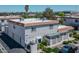 An aerial view of the property featuring a tile roof and lush landscaping at 1101 Willow Tree Dr # D, Las Vegas, NV 89128