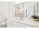 Bathroom with a large mirror, white cabinets, toilet, and walk-in shower at 1101 Willow Tree Dr # D, Las Vegas, NV 89128