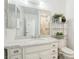 Bathroom featuring a white vanity with a marble countertop, white cabinets and stainless steel fixtures at 1101 Willow Tree Dr # D, Las Vegas, NV 89128