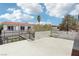 Condo exterior showcasing a spacious patio area with white fencing, great for outdoor living at 1101 Willow Tree Dr # D, Las Vegas, NV 89128