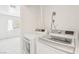 Convenient laundry room with modern washer and dryer units, located off the bedroom at 1101 Willow Tree Dr # D, Las Vegas, NV 89128