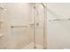 Walk-in shower with a shower head, marble design, a built-in shelf, and a grab bar at 1101 Willow Tree Dr # D, Las Vegas, NV 89128