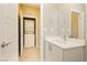 Efficient bathroom featuring a modern vanity and stacked washer/dryer closet, optimizing space and convenience at 11236 Rainbow Peak Ave # 210, Las Vegas, NV 89135