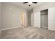 Neutral bedroom with plush carpet, closet, and view into bathroom at 11236 Rainbow Peak Ave # 210, Las Vegas, NV 89135