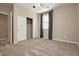 Neutral bedroom featuring a ceiling fan, plush carpet, natural light, and closet space at 11236 Rainbow Peak Ave # 210, Las Vegas, NV 89135