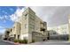Modern townhome with stylish exterior, boasting multiple stories and private garages in a well-maintained community at 11236 Rainbow Peak Ave # 210, Las Vegas, NV 89135
