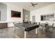 Well-appointed game room boasts a pool table, TV, and comfortable seating area at 11236 Rainbow Peak Ave # 210, Las Vegas, NV 89135