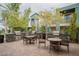 Outdoor grilling area with multiple grills, tables, and seating for community enjoyment at 11236 Rainbow Peak Ave # 210, Las Vegas, NV 89135
