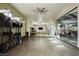 Well-equipped gym features mirrored walls, a ceiling fan and varied exercise equipment at 11236 Rainbow Peak Ave # 210, Las Vegas, NV 89135
