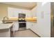 Updated kitchen with stainless steel appliances, bright white cabinets, and a functional layout at 11236 Rainbow Peak Ave # 210, Las Vegas, NV 89135