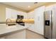 Modern kitchen with sleek white cabinets, stainless steel appliances, and ample counter space at 11236 Rainbow Peak Ave # 210, Las Vegas, NV 89135