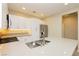 Contemporary kitchen with stainless steel appliances, quartz countertops, and white cabinets at 11236 Rainbow Peak Ave # 210, Las Vegas, NV 89135
